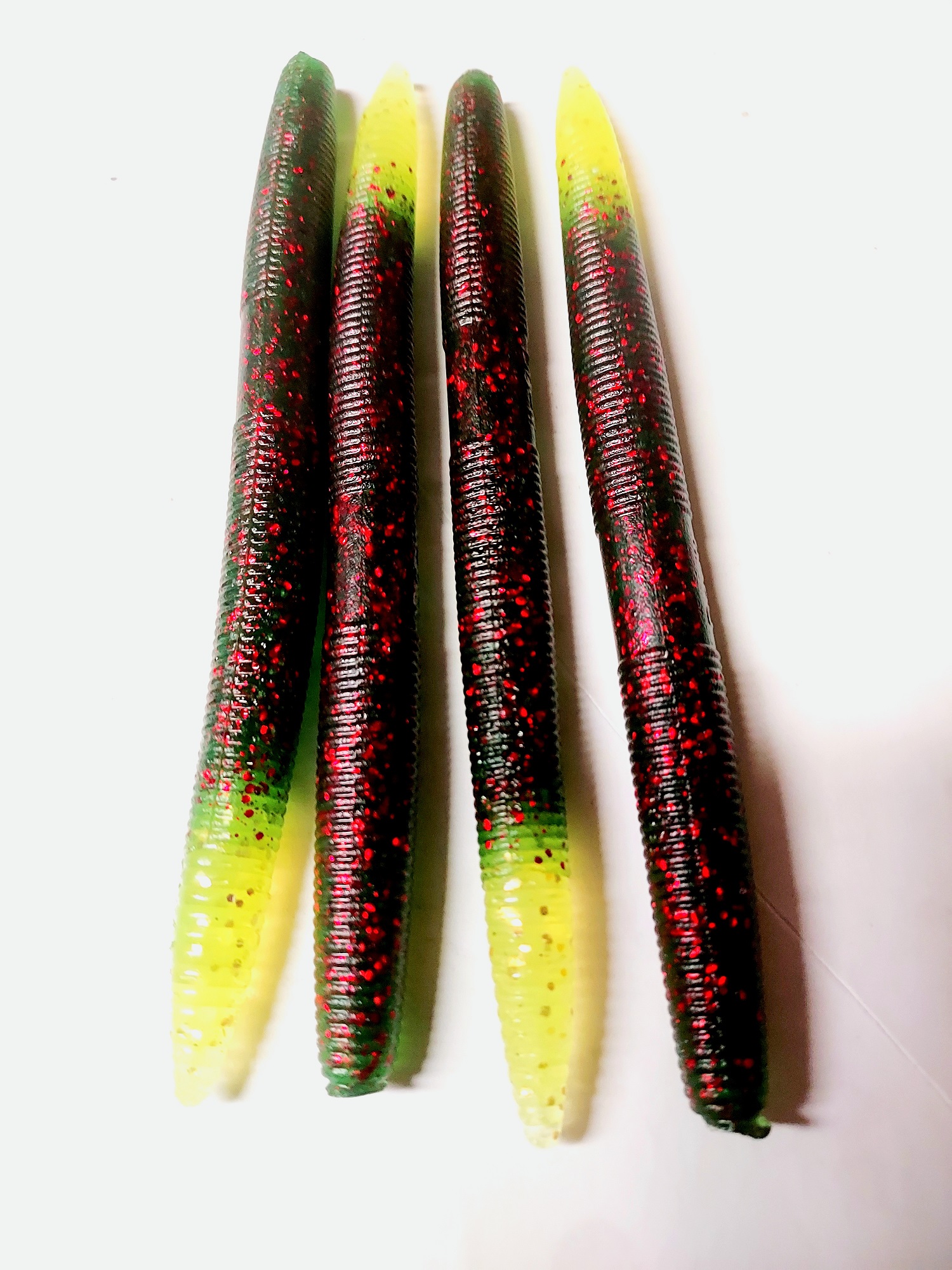 Stick bait 6 inches . All tails will be chartreuse. The main body will be  watermelon red. We call the 6 inch baits Papa - Get Hooked Magic Baits